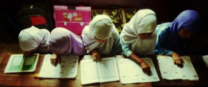 TOPSHOTS Indian Muslim girls recite the Holy Quran in their class room during the holy month of Ramadan at Madrasatur-Rashaad religious school in Hyderabad on July 17, 2013. As well as abstinence and fasting during Ramadan, Muslims are encouraged to pray and read the Quran during Islam's holiest month. AFP PHOTO / Noah SEELAMNOAH SEELAM/AFP/Getty Images
