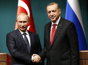 Russia's President Vladimir Putin (L) shakes hands with Turkey's President Tayyip Erdogan after a news conference at the Presidential Palace in Ankara December 1, 2014. REUTERS/Umit Bektas (TURKEY - Tags: POLITICS)