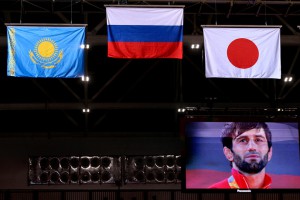 RIO DE JANEIRO, BRAZIL - AUGUST 6, 2016: Gold medallist Beslan Mudranov (on the screen) of Russia seen during the victory ceremony for the men's -60 kg judo event at the Rio 2016 Summer Olympic Games. Valery Sharifulin/TASS Áðàçèëèÿ. Ðèî-äå-Æàíåéðî. 6 àâãóñòà 2016. Ðîññèéñêèé ñïîðòñìåí Áåñëàí Ìóäðàíîâ (íà ýêðàíå), çàâîåâàâøèé çîëîòóþ ìåäàëü â ñîðåâíîâàíèÿõ ïî äçþäî ñðåäè ìóæ÷èí â âåñîâîé êàòåãîðèè äî 60 êã, íà öåðåìîíèè íàãðàæäåíèÿ íà XXXI ëåòíèõ Îëèìïèéñêèõ èãðàõ. Âàëåðèé Øàðèôóëèí/ÒÀÑÑ