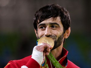RIO DE JANEIRO, BRAZIL - AUGUST 6, 2016: Winner Beslan Mudranov of Russia kisses his gold medal during the victory ceremony for the men's -60 kg judo event at the Rio 2016 Summer Olympic Games. Valery Sharifulin/TASS Áðàçèëèÿ. Ðèî-äå-Æàíåéðî. 6 àâãóñòà 2016. Ðîññèéñêèé ñïîðòñìåí Áåñëàí Ìóäðàíîâ, çàâîåâàâøèé çîëîòóþ ìåäàëü â ñîðåâíîâàíèÿõ ïî äçþäî ñðåäè ìóæ÷èí â âåñîâîé êàòåãîðèè äî 60 êã, íà öåðåìîíèè íàãðàæäåíèÿ íà XXXI ëåòíèõ Îëèìïèéñêèõ èãðàõ. Âàëåðèé Øàðèôóëèí/ÒÀÑÑ