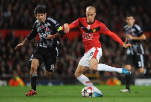 MANCHESTER, UNITED KINGDOM - NOVEMBER 25: Gabriel Obertan of Manchester United shoots under pressure from Ibrahim Uzulmez of Besiktas during the UEFA Champions League Group B match between Manchester United and Besiktas at Old Trafford on November 25, 2009 in Manchester, England. (Photo by Laurence Griffiths/Getty Images)