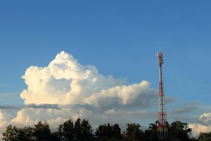 telephone tower base station among jungle in afternoon