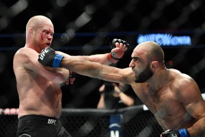 Mar 9, 2019; Wichita, KS, USA; Tim Boetsch (red gloves) and Omari Akhmedov (blue gloves) during UFC Fight Night at InTrust Arena. Mandatory Credit: Kelly Ross-USA TODAY Sports Images