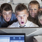 Group of people looking shocked at computer screen