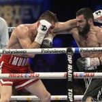 Artur Beterbiev, right, and Callum Smith fight in a light heavyweight boxing bout Saturday, Jan. 13, 2024, in Quebec City. (Patrice Laroche/The Canadian Press via AP)